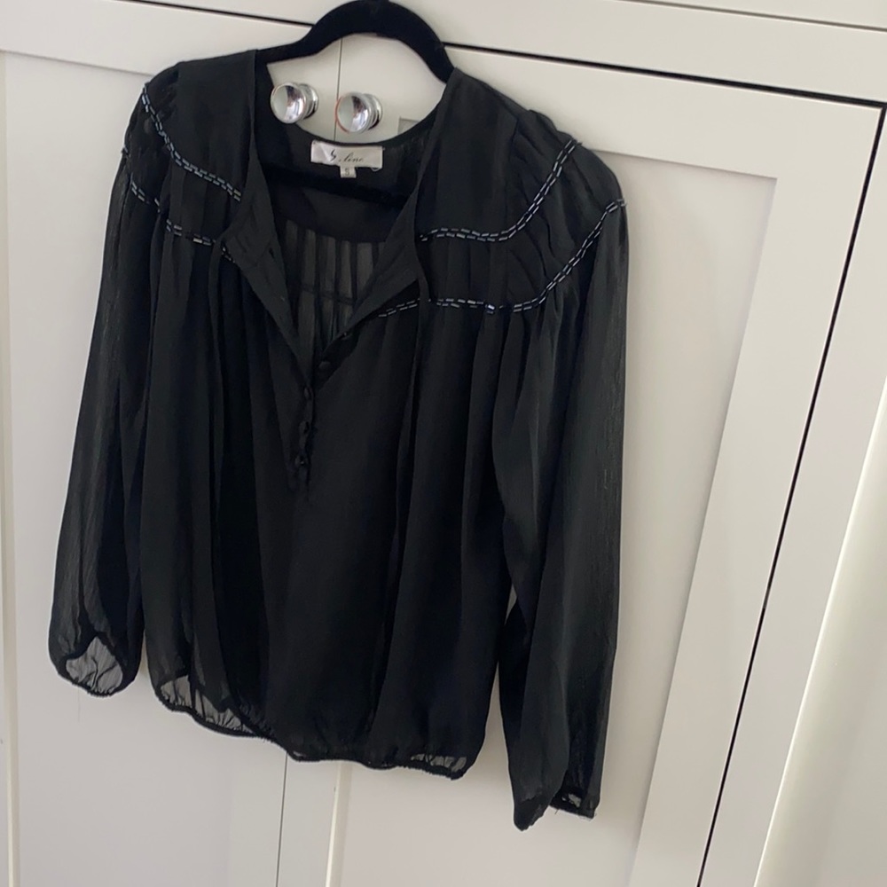 Sheer black blouse